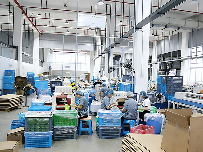 Warehouse worker handling sports tape raw materials in manufacturing factory 